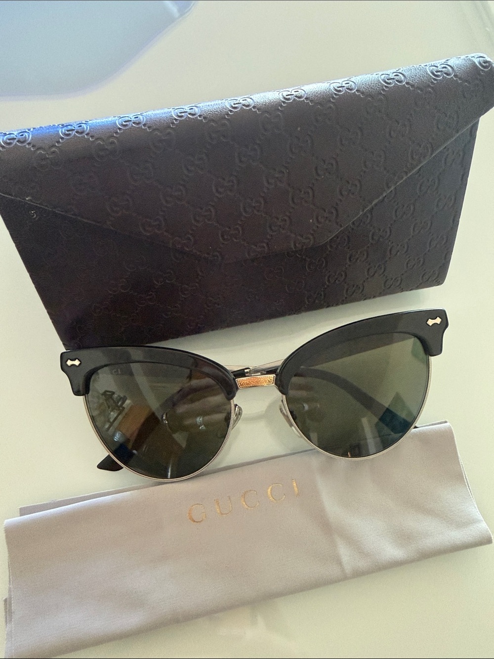 Gucci Women's Cat-Eye Sunglasses - Black Frame with Gold Sides